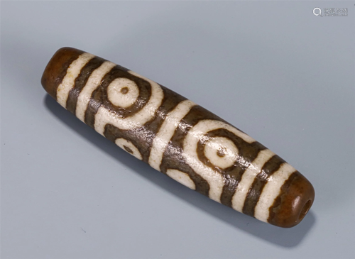 A CHINESE SEVEN-EYED DZI BEAD