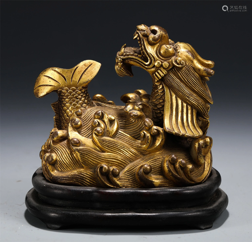 A CHINESE GILT BRONZE MYTHICAL BEAST DECORATION