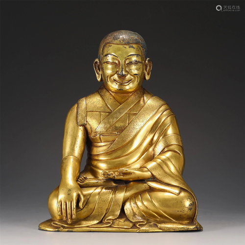 A CHINESE GILT BRONZE FIGURE OF SEATED BUDDHA