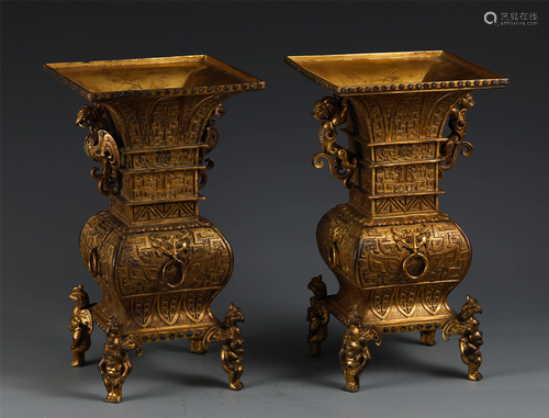 TWO CHINESE FOUR-FOOTED GILT BRONZE VASES