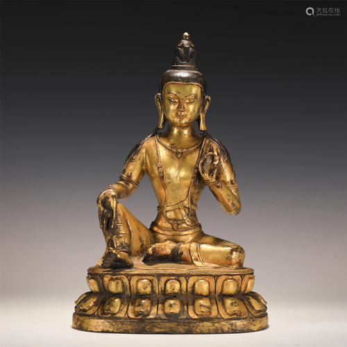 A CHINESE GILT BRONZE FIGURE OF SEATED BUDDHA GUANY…