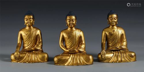 A GROUP OF THREE CHINESE GILT BRONZE FIGURES OF BUDDHAS