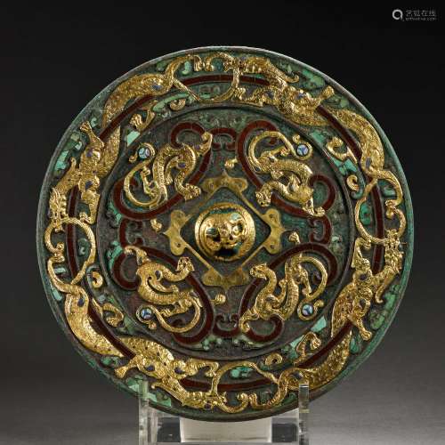 MIRROR INLAID WITH GOLD, SILVER AND TURQUOISES, WARRING STAT...