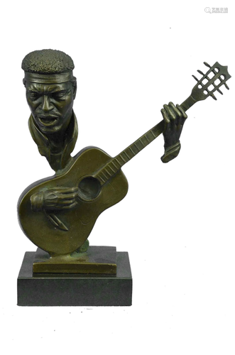 Abstract man playing Guitar Bronze