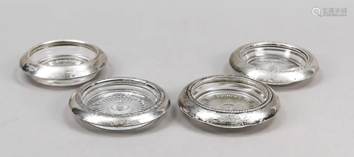 Four coasters with silver rim