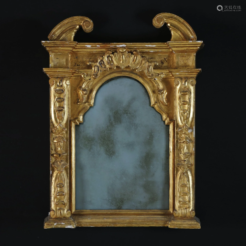 A carved gilt wood wall mirror, 17th century