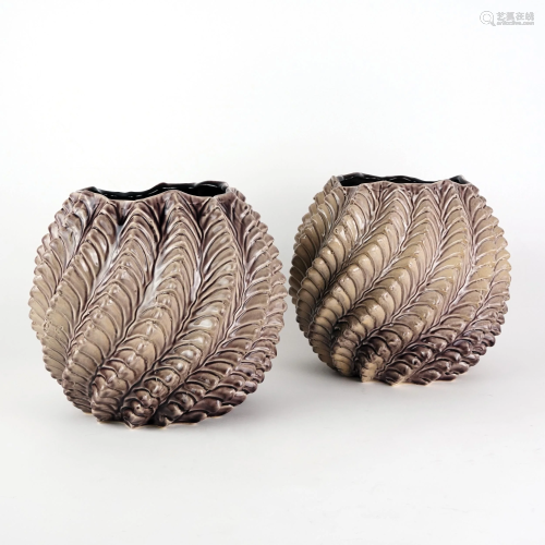 A pair of twisted brown ceramic vases