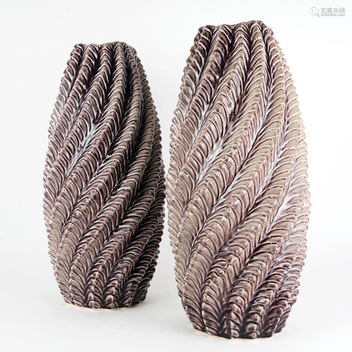 A pair of twisted brown ceramic vases