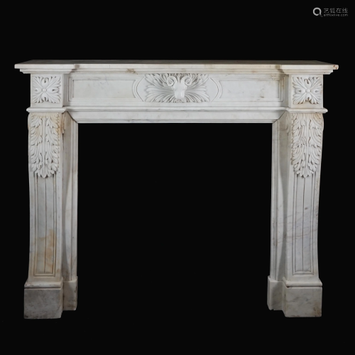 A carved white marble chimneypiece