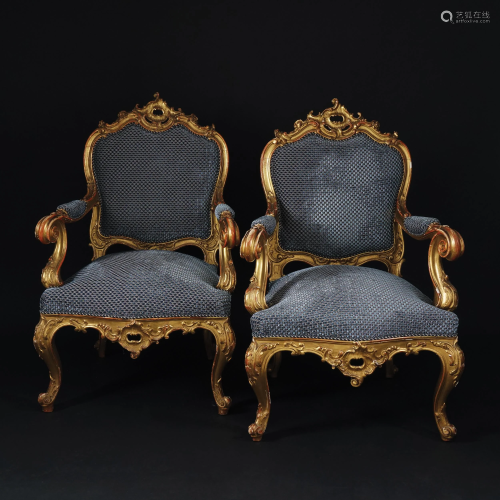A pair of carved gilt wood armchairs, 19th century