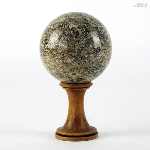 A lumachella marble sphere