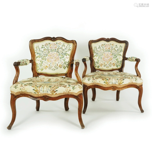 A pair of French bois naturel armchairs, 18th century