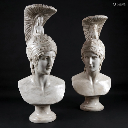 A pair of white marble busts of a warrior with a