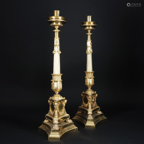 A pair og chiseled gilt bronze large candelesticks