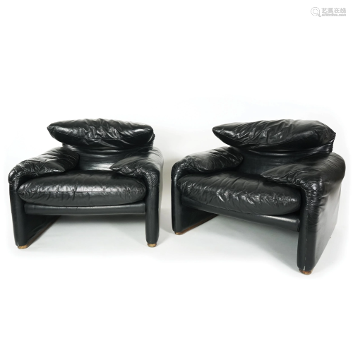 A pair of black leather covered Maralunga armchairs