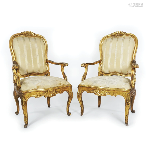 A pair of Roman carved gilt wood armchairs, 18th