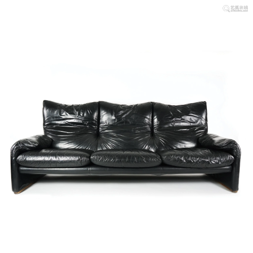 A black leather covered Maralunga sofa