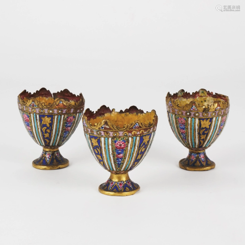 3 Russian gilt metal and polychrome enamel egg carriers
