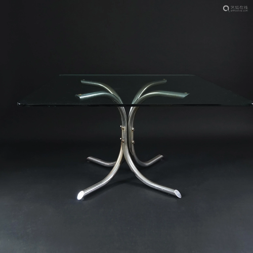 An Italian square crystal top chrome table