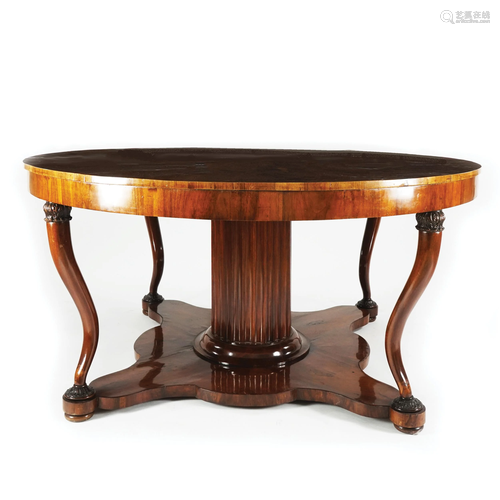 A walnut venereed round top table, 19th century