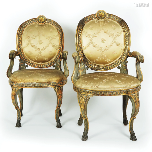 A pair of Roman gilt and black lacquered carved