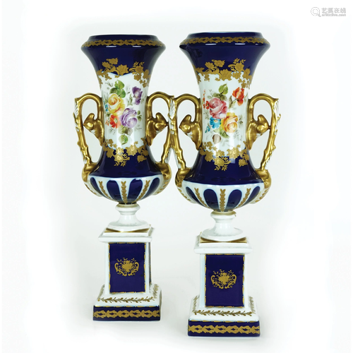 A pair of French white, gilt, blue and polychrome vases