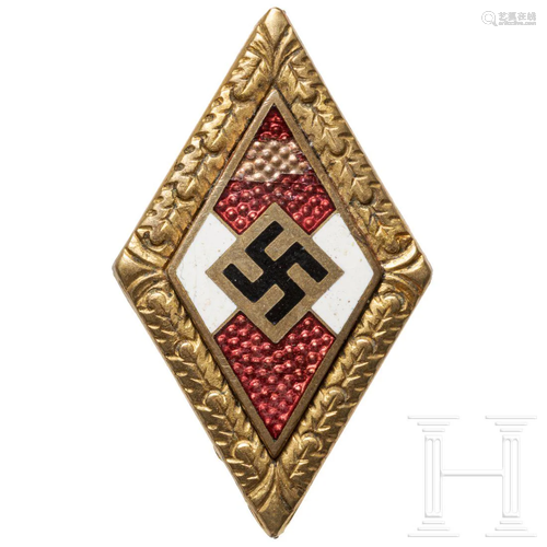 A golden Hitler Youth Honour Badge with Oak Leaves