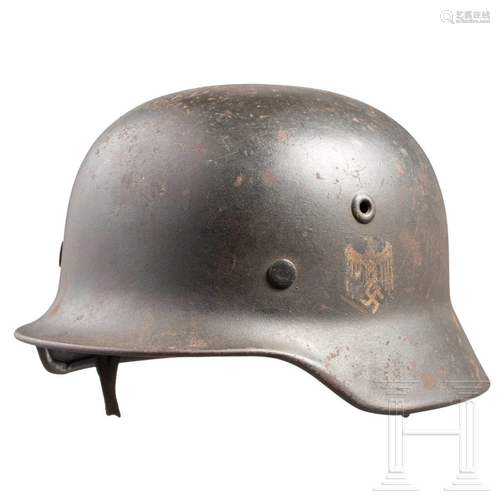 An army steel helmet M 40 with a single decal