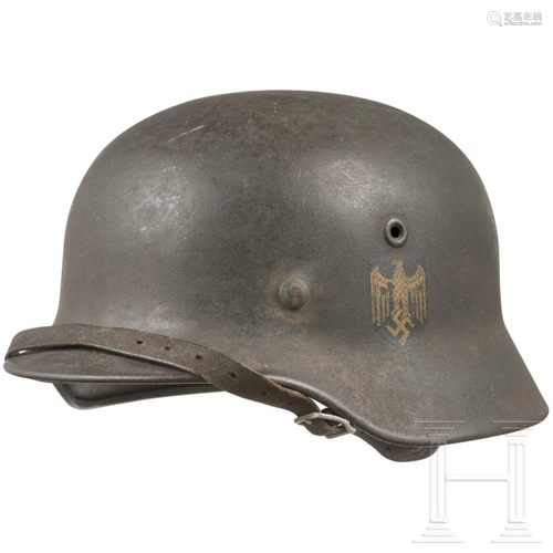 A Kriegsmarine steel helmet M 40 with a single decal