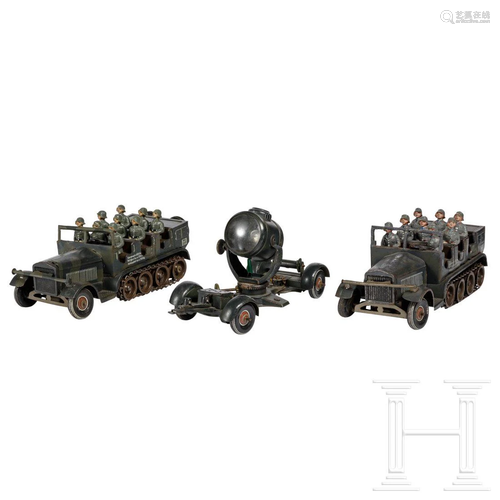 Two TippCo half-tracks WL 217 with sitting soldiers and