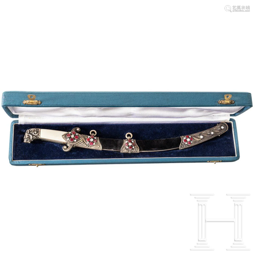 A cased miniature magnate's sabre - a present from the