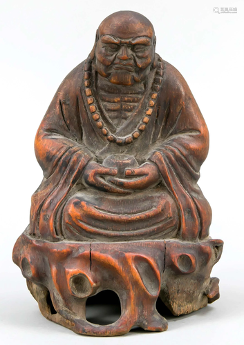 Bamboo figure of a praying mon