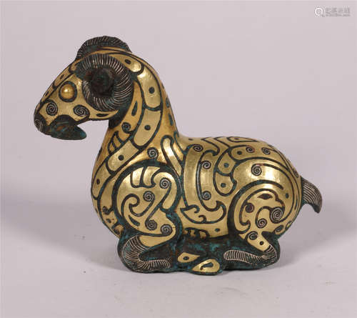 A GILT BRONZE RESTING RAM OR SHEEP FIGURINE