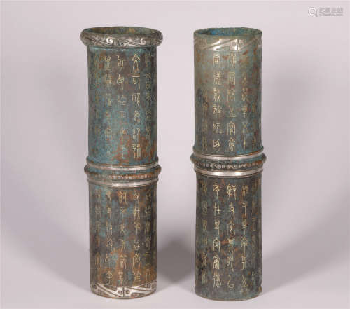 A BAMBOO SHAPED BRONZE CONTAINER