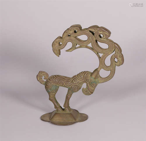 A SILVER STANDING MYTHICAL AUSPICIOUS  ANIMAL FIGURINE