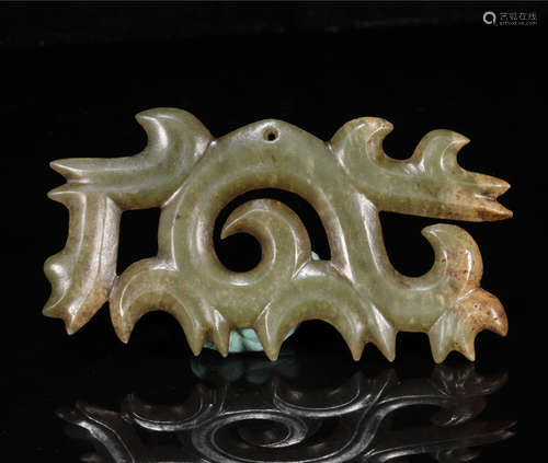 AN ARCHAEOLOGICAL CELADON JADE PENDANT