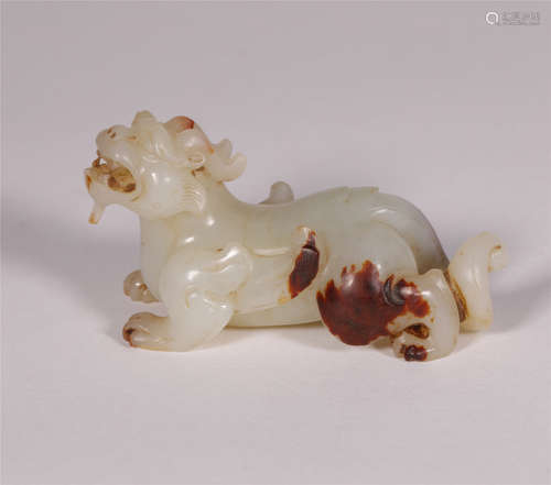 A PALE CELADON JADE MYTHICAL BEAST FIGURINE