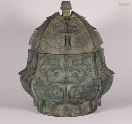 A FALCON DESIGN BRONZE LEI VESSEL