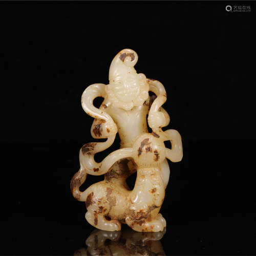 A DECORATIVE JADE HUMAN FIGURINE