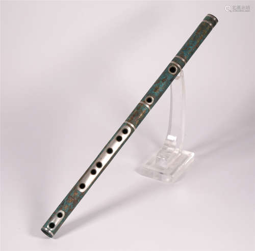 A BRONZE FLUTE INSTRUMENT