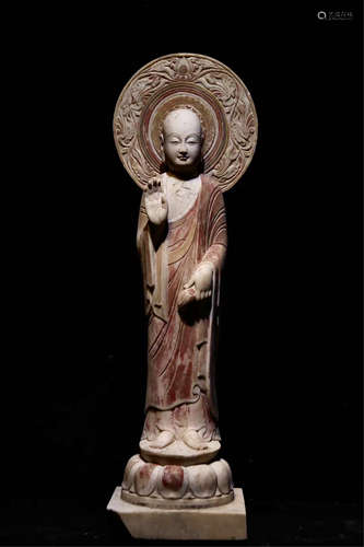 A STANDING BUDDHA STATUE