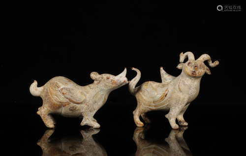 A PAIR OF HAN DYNASTY STYLE BEAST FIGURINES