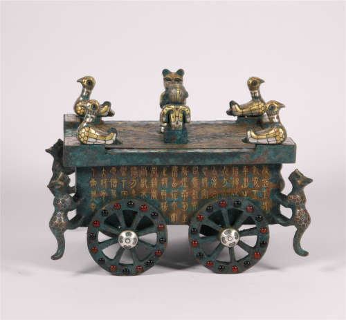 A CHARIOT-SHAPED BRONZE JEWELLERY BOX