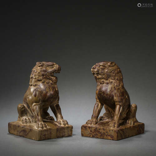 A PAIR OF CHINESE TANG DYNASTY BLUESTONE LIONS