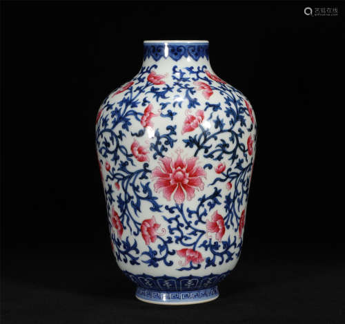 The plum vase of red flowers in the blue and white glaze of ...
