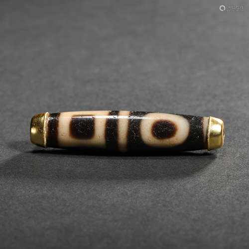 DZI BEAD COVERED WITH GOLD IN THE ENDS OF THE BEAD, TANG DYN...