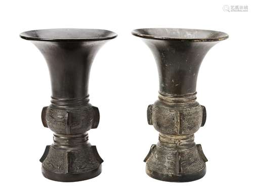 TWO ARCHAICISTIC BRONZE WINE VESSELS, QING DYNASTY the sides...