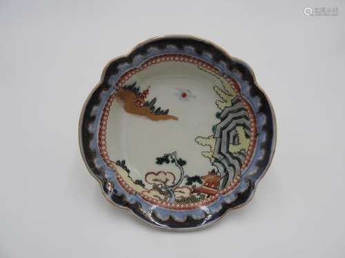 JAPANESE IMARI ENAMELLED LOBED DISH 18TH CENTURY depicting m...