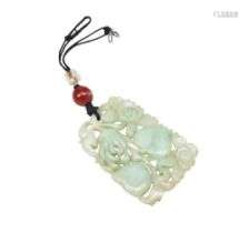 CARVED JADEITE PENDANT  LATE QING DYNASTY carved with pomegr...