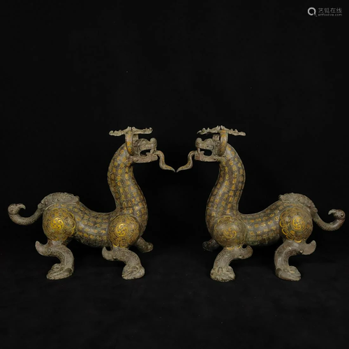 A pair of bronze and gold beasts in the Warring States